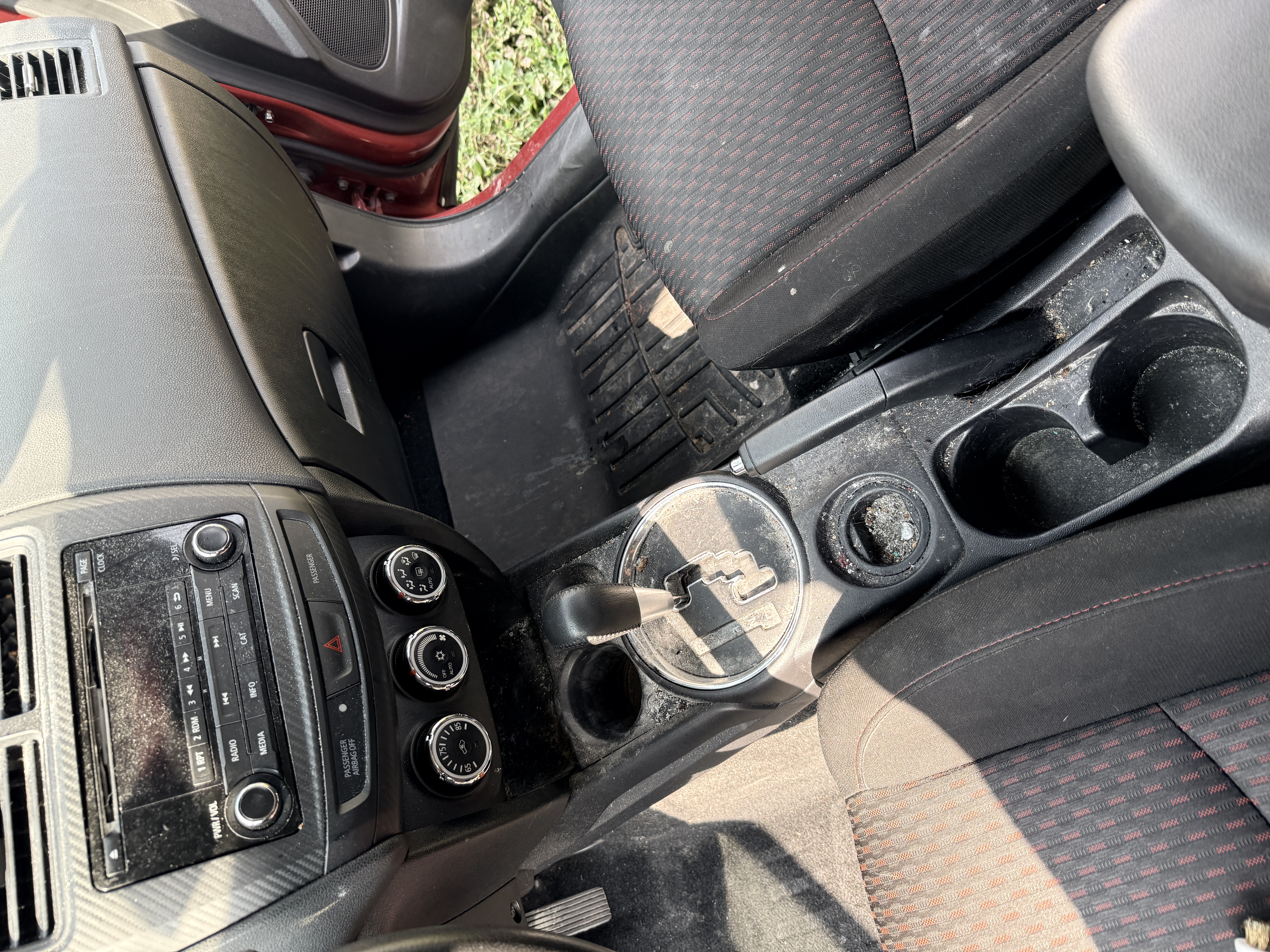 Mitsubishi center console before detail, dust and debris in cupholders and vents