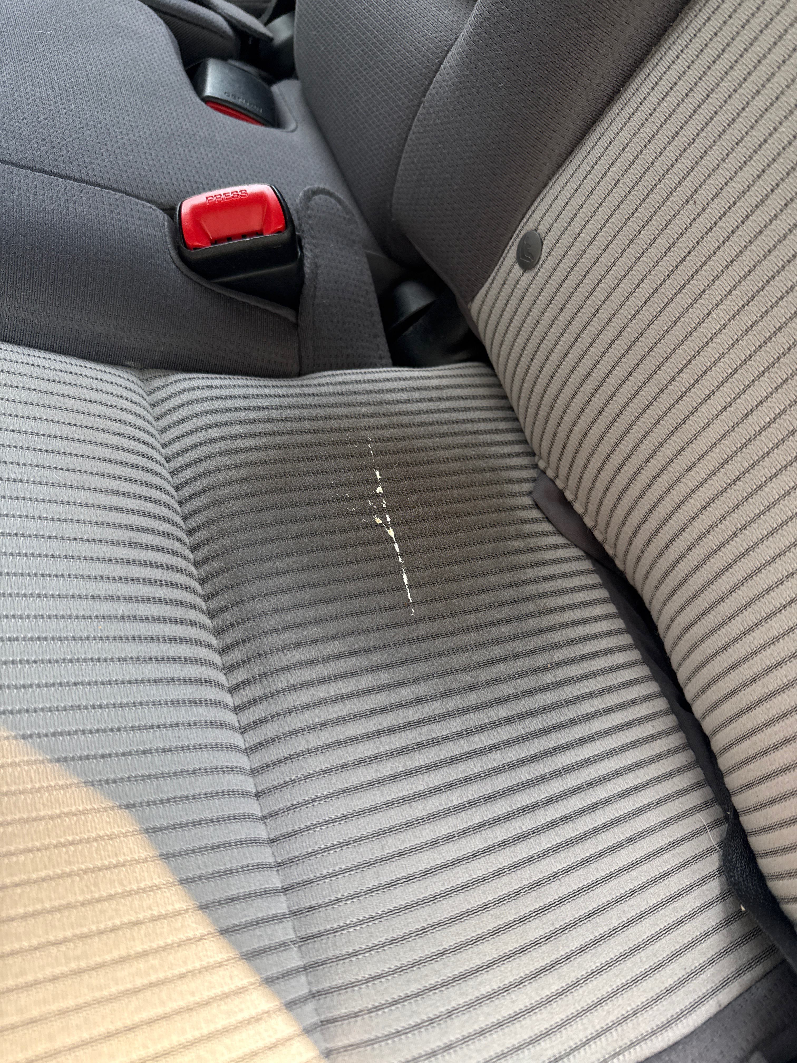 Rear seat fabric with mold and staining mark visible