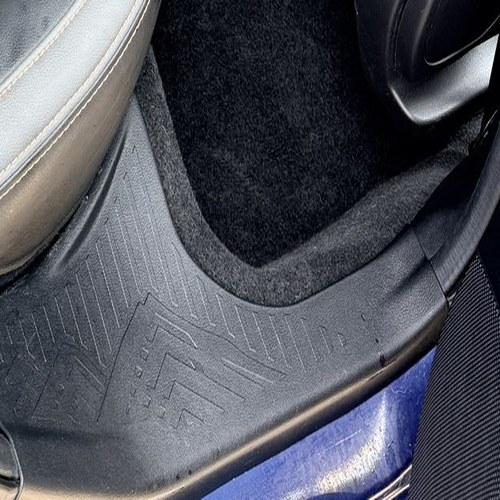Close-up of the same rear floor mat, hair fully removed
