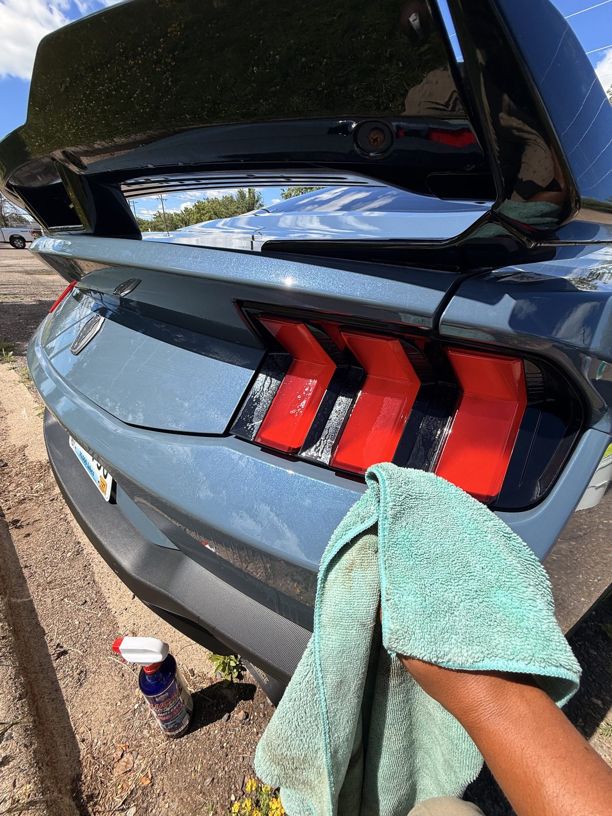Wiping down a detailed exterior panel on-site