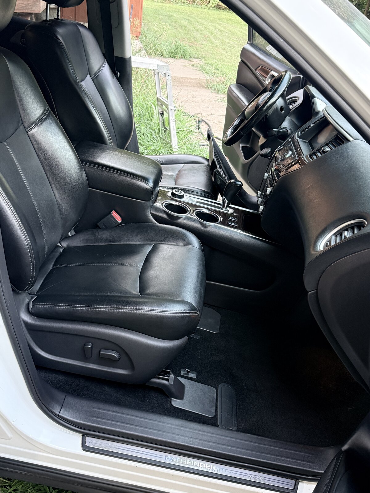 Same Nissan Pathfinder driver's seat and floor, fully detailed and clean