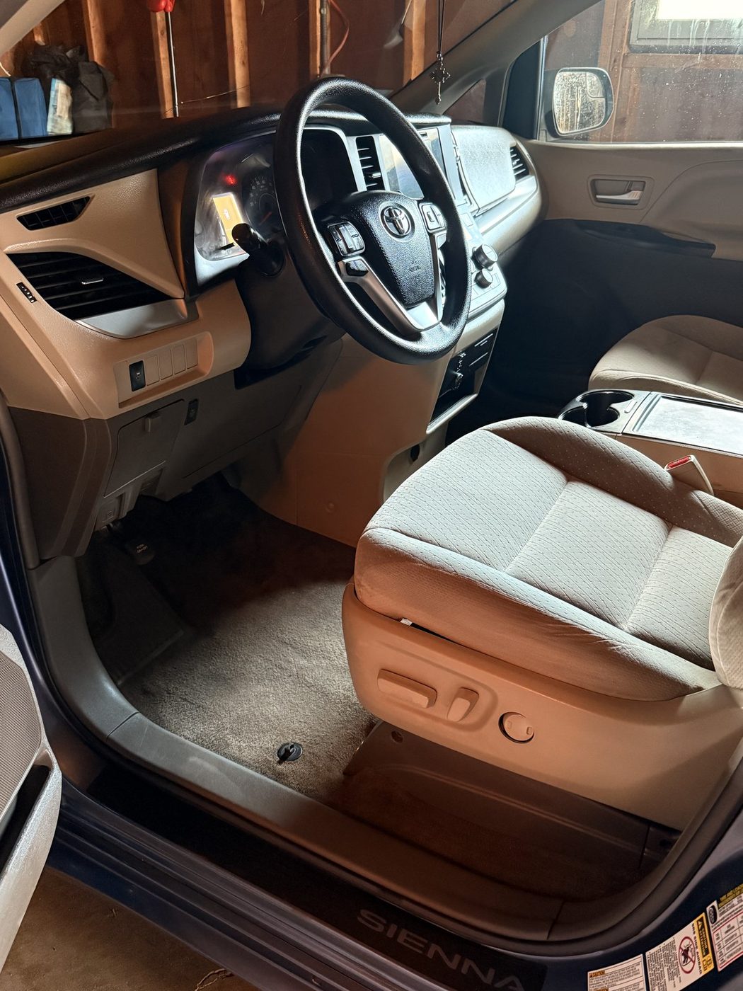 Same Toyota Sienna interior after full detail, dash and seats clean