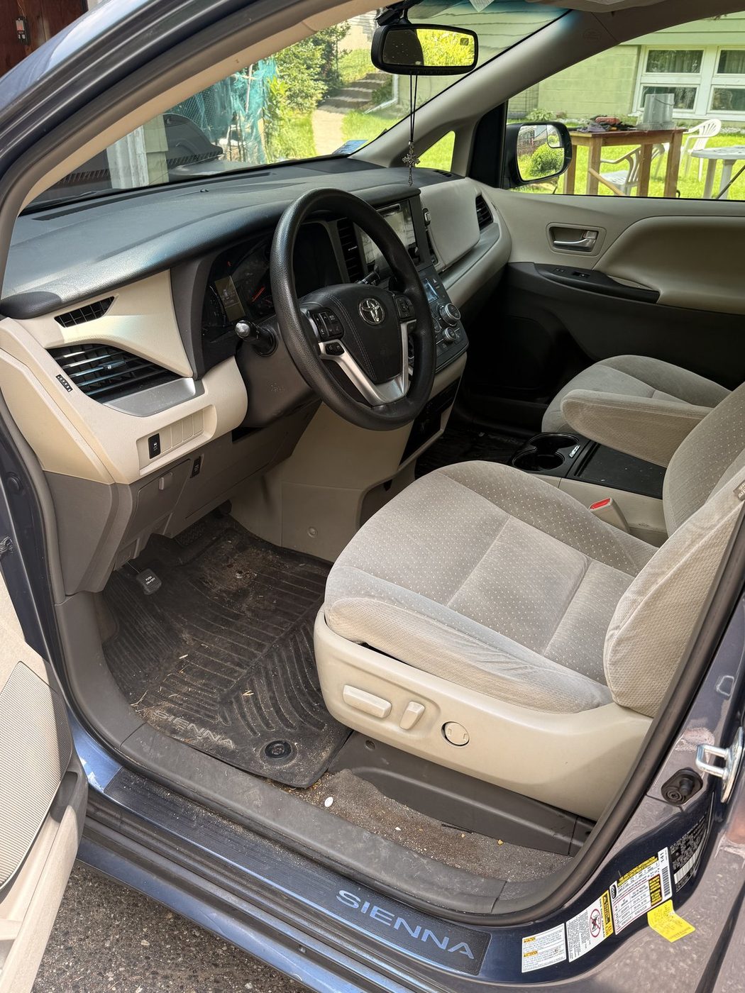 Toyota Sienna interior before detail, cluttered cargo area