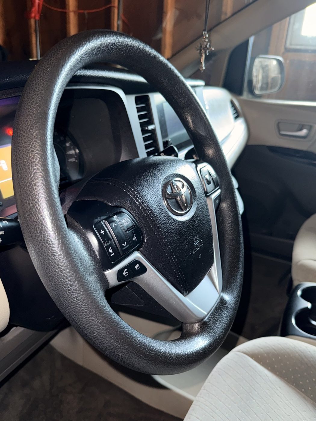 Detailed Toyota Sienna steering wheel and dash close-up